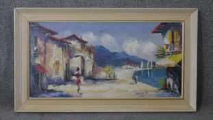 A framed oil on canvas of a Mediterranean village, signed Campria. H.53 W.92cm