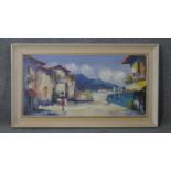 A framed oil on canvas of a Mediterranean village, signed Campria. H.53 W.92cm