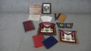 A collection of Masonic items. Including a masonic lodge sign, various embroidered badges with