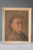 A framed mid century oil on canvas portrait of a gentleman in a brown jacket. Unsigned. H.53 W.42cm.