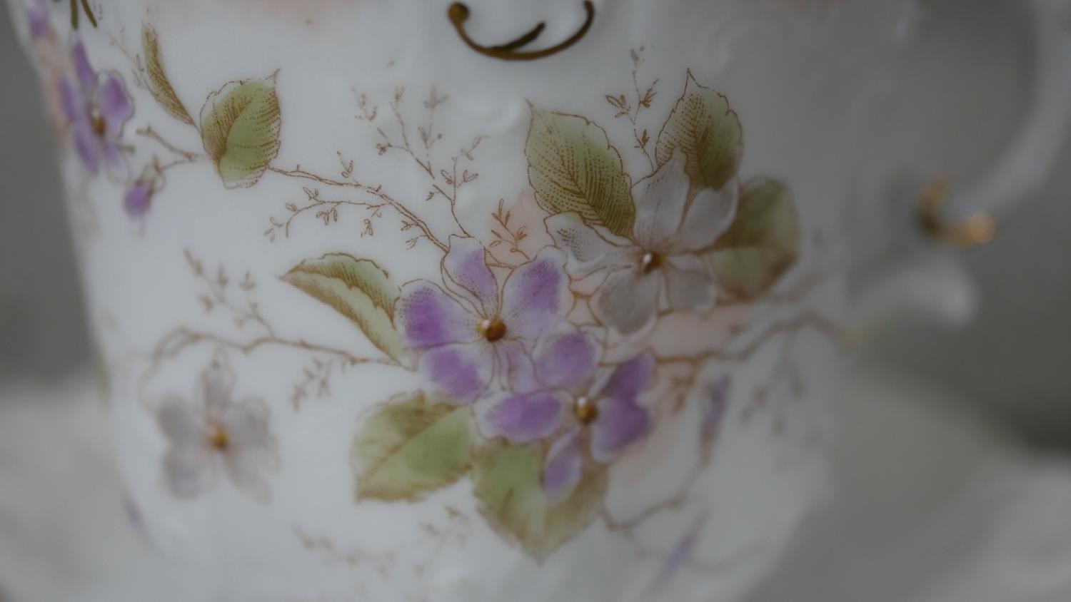 A Victorian hand painted fine china ten person part coffee set. Decorated with violets and gilded - Image 8 of 14