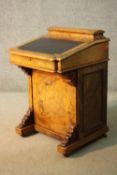 A Victorian burr walnut Davenport with lidded pen section above leather lined writing surface