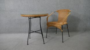 A contemporary wicker conservatory table and matching tub chair. H.68 Diam.59cm (table)