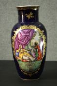 A large hand painted Sevres style vase. One side decorated with a lady and her attendant and one