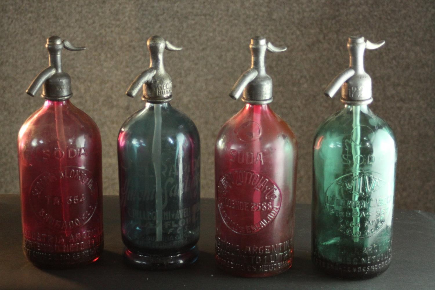 A collection of four vintage Ricardo Zottola soda syphons with chrome spouts. H.30cm.