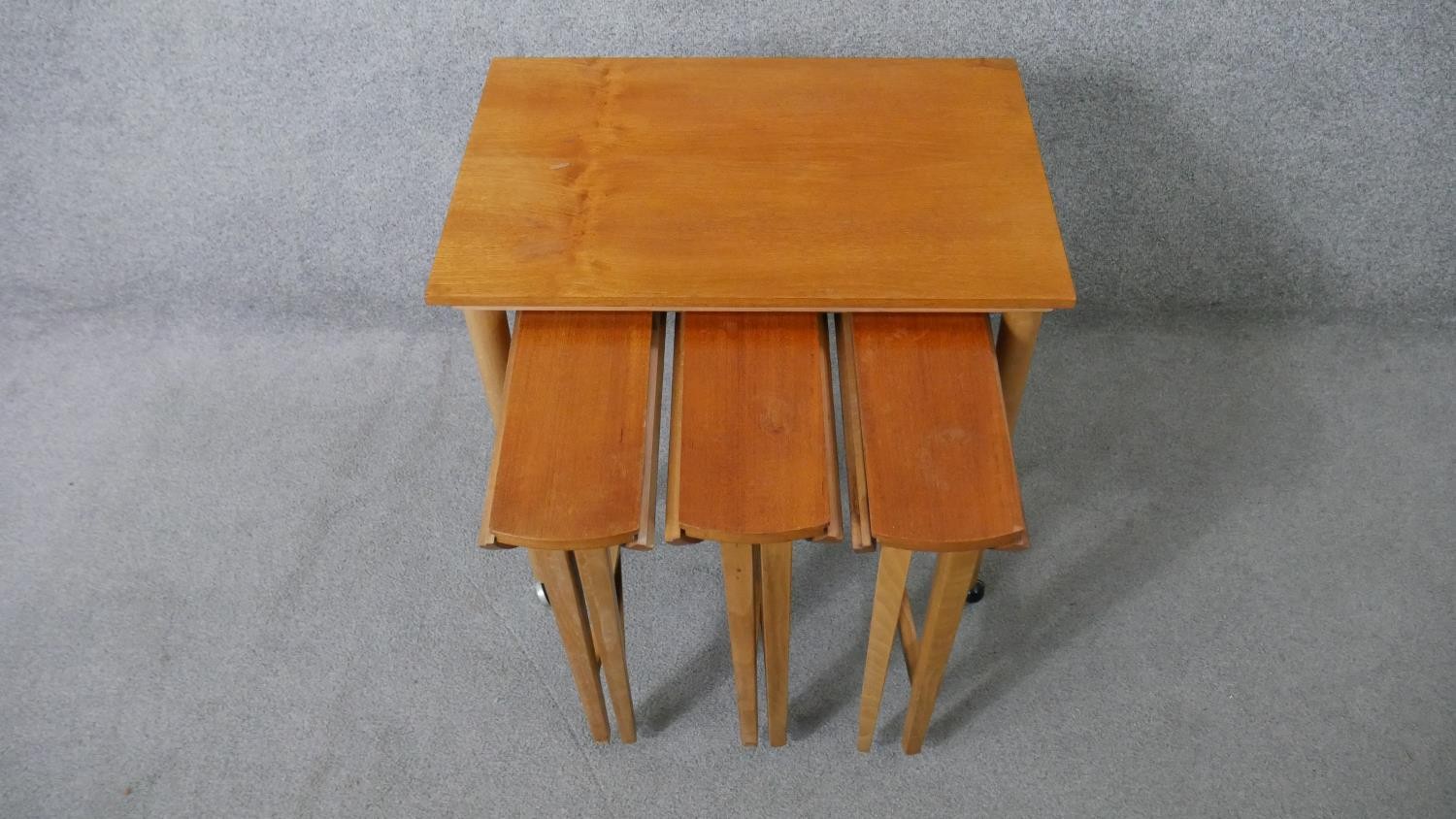 A vintage light teak nest of tables on beech supports fitted with three slide out drop flap - Image 4 of 8