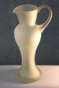 A vintage hand blown frosted clear art glass jug of elongated form. H.39 W.18 D.14cm.