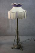 Lamp standard, 19th century brass converted to electricity with original fringed shade along with an