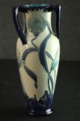 An early 20th century Burmantofts Faience three handled vase with incised Wild Tulip decoration in