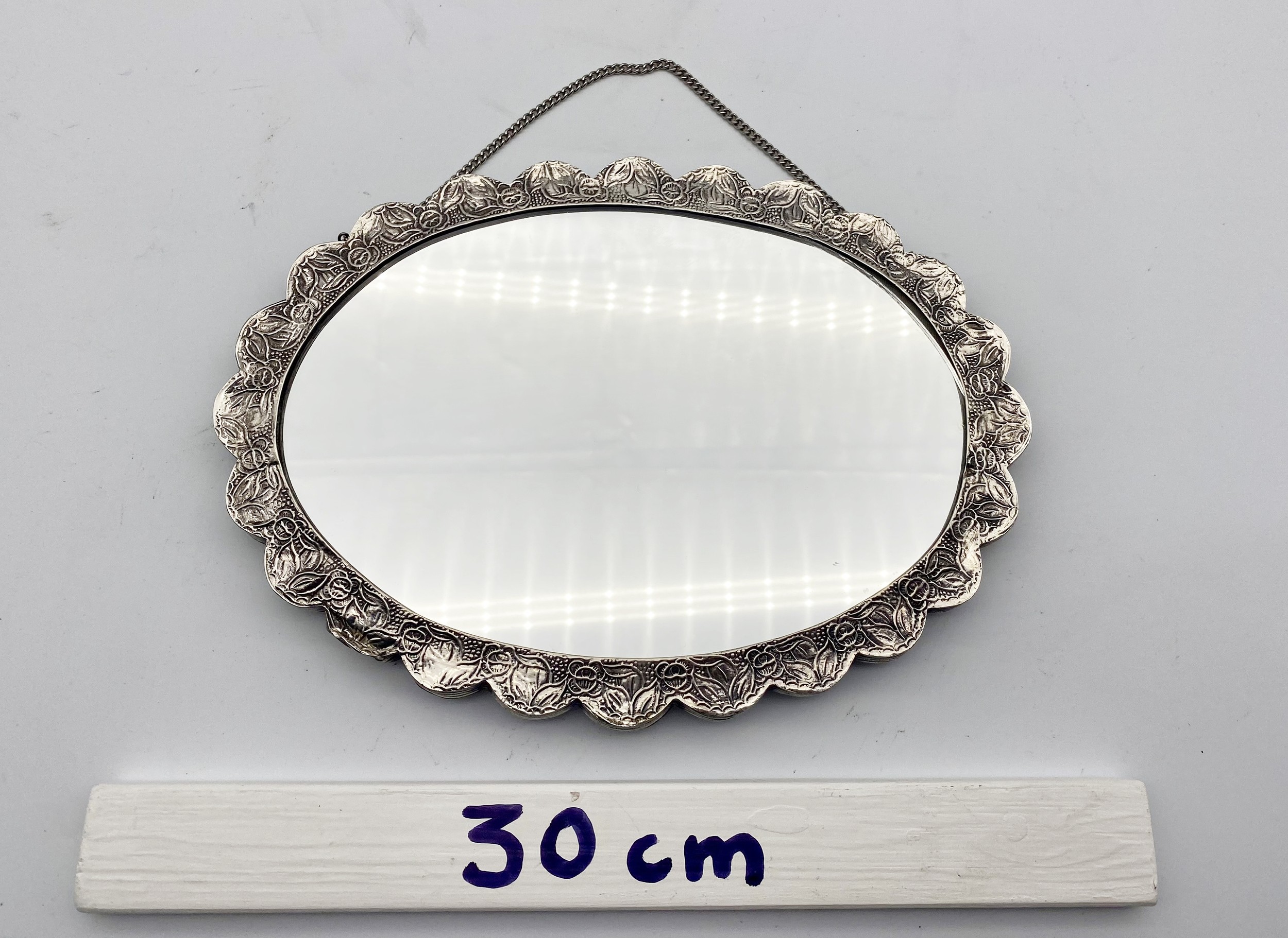 A 20th century Indian silver repousse mirror with stylised foliate and floral design and hanging - Image 7 of 8