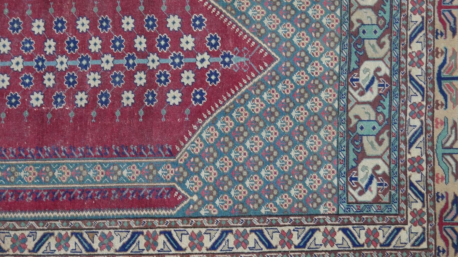 A Turkish Kayseri prayer mat with burgundy ground and floral multiple borders. L.170 W.115cm - Image 4 of 7