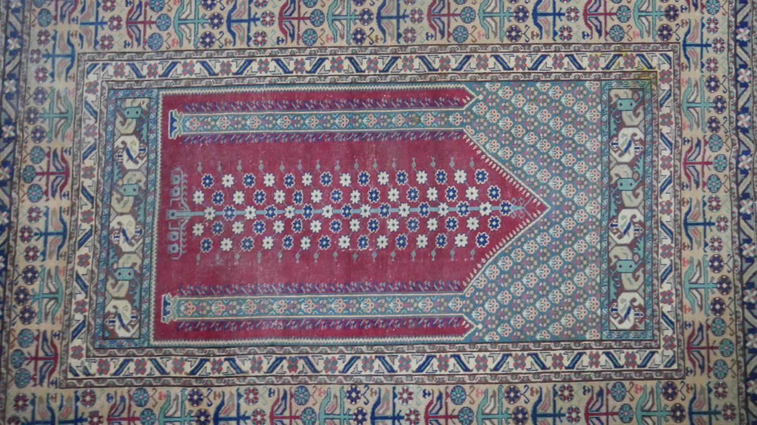 A Turkish Kayseri prayer mat with burgundy ground and floral multiple borders. L.170 W.115cm - Image 3 of 7