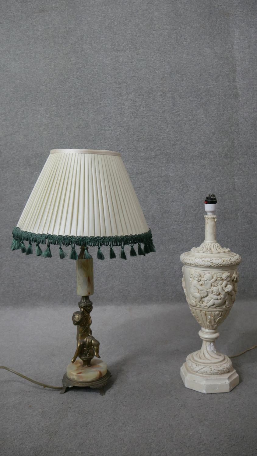 Two classical style table lamps. One vintage alabaster and gilt spelter cherub lamp along with a