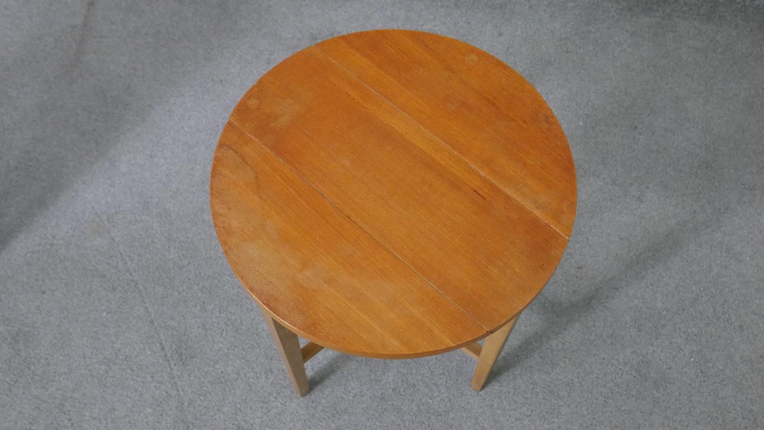 A vintage light teak nest of tables on beech supports fitted with three slide out drop flap - Image 8 of 8