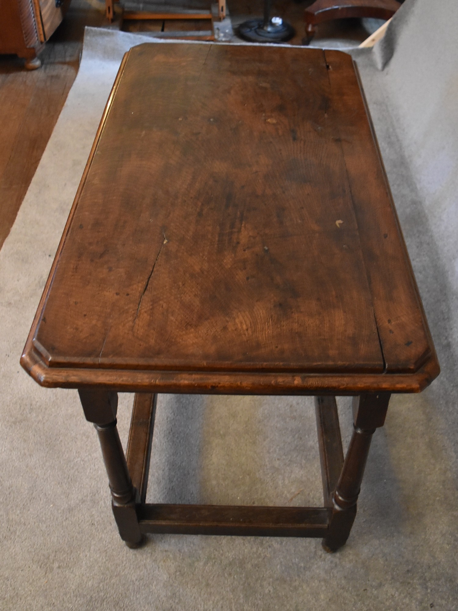 An antique oak hall or centre table on turned stretchered supports. H.76 x 112 x 63cm - Image 4 of 4