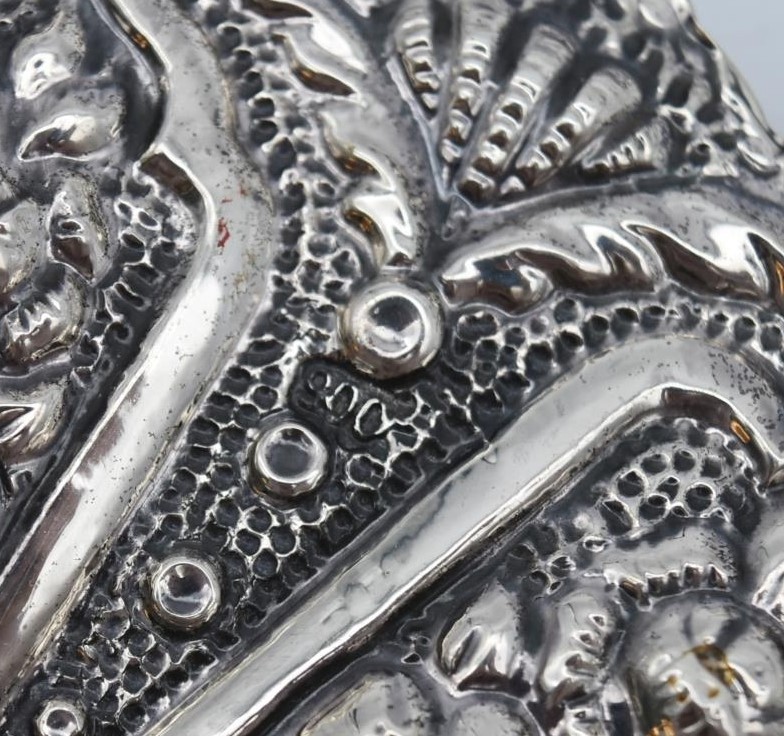 A 20th century Indian silver repousse mirror with stylised foliate and floral design and hanging - Image 8 of 8