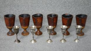 Two sets of goblets. Including a set of six vintage wood and leather goblets and a set of five