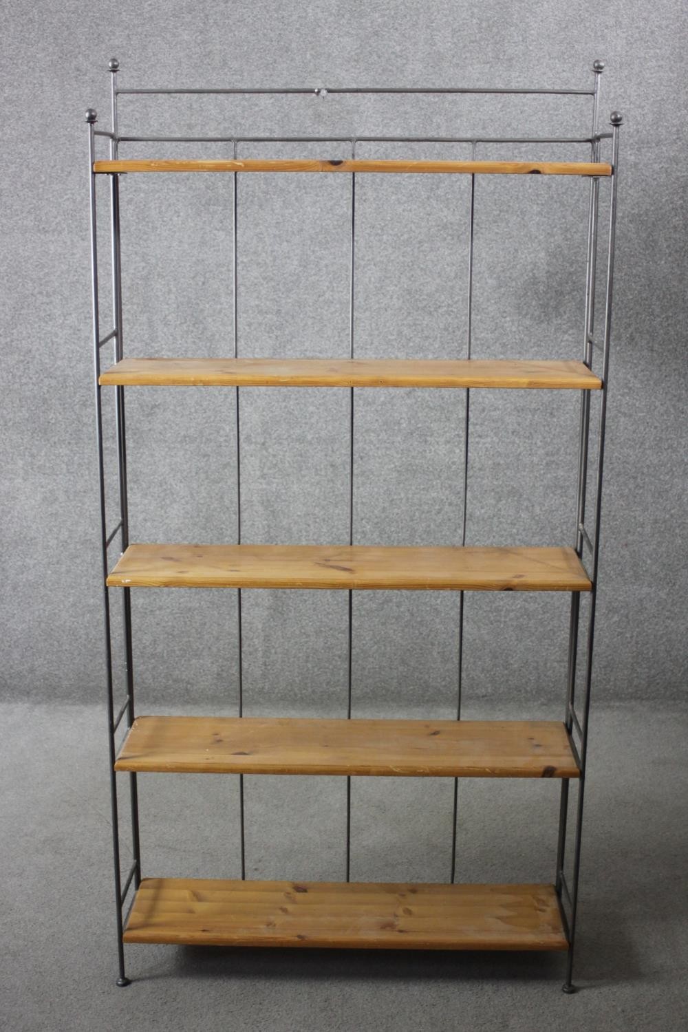 A set of metal framed floor standing open shelves. H.170 W.86 D.24 cm.