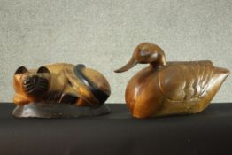 A carved and painted cat figure and a similar of a duck. H.30 W.53 D.15 cm. (largest)