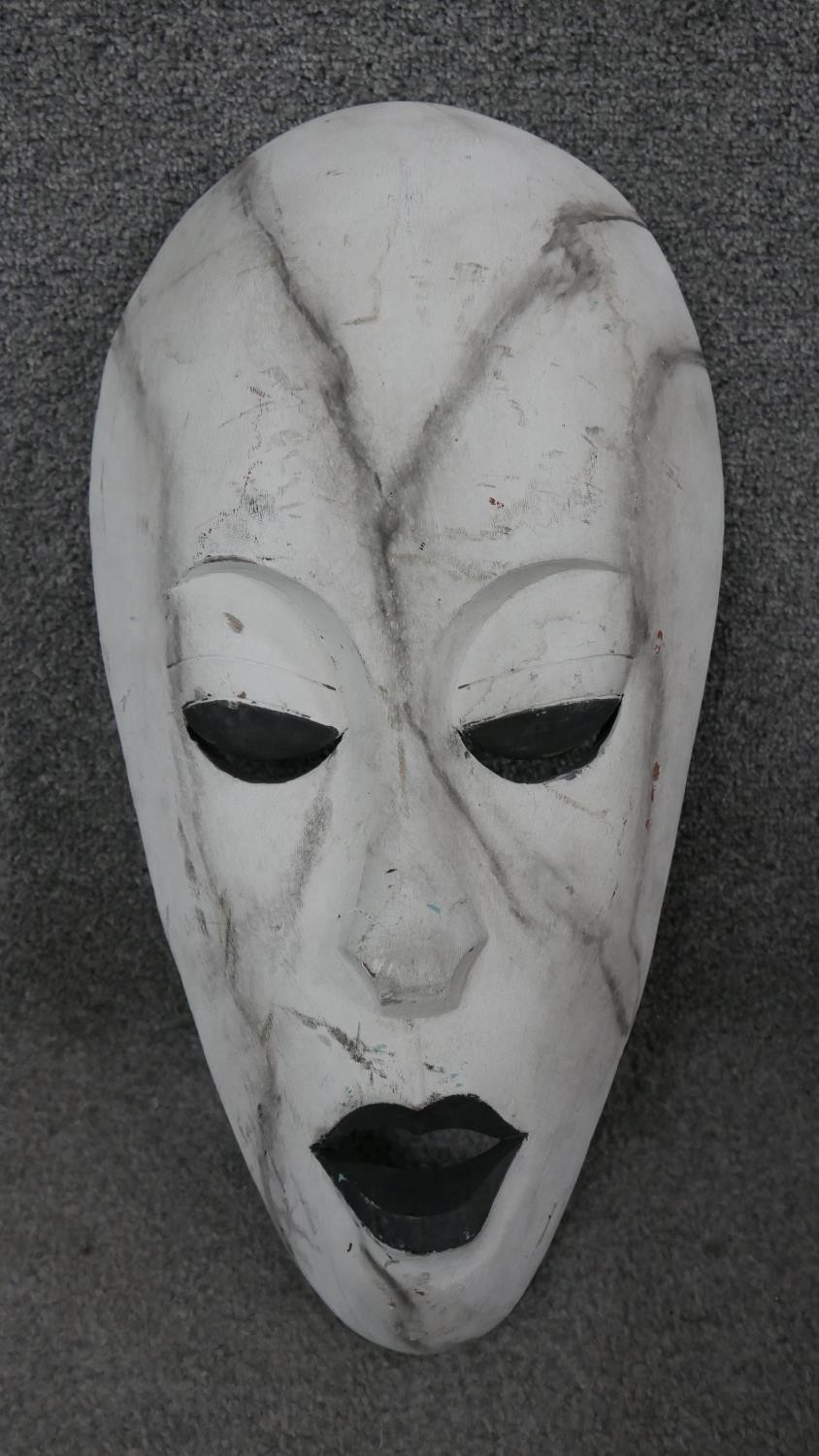 Three carved hardwood African tribal masks. H.44 W.25cm (largest) - Image 2 of 7