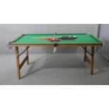 A Riley folding snooker table and accessories. H.83 W.190 D.87cm (Baize worn and legs in need of