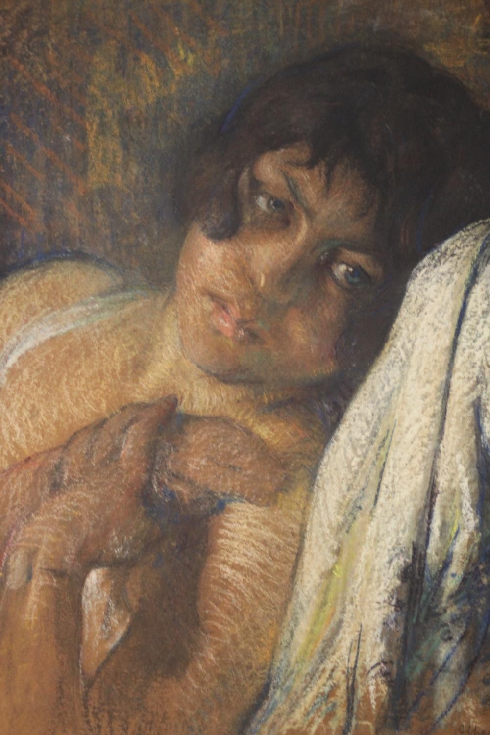 A framed pastel portrait of a young woman reclining in a chair. Indistinctly signed. H.58 W.50cm. - Image 2 of 4