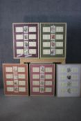 WITHDRAWN - Five framed and glazed collections of antique embroidered silk floral cigarette cards.