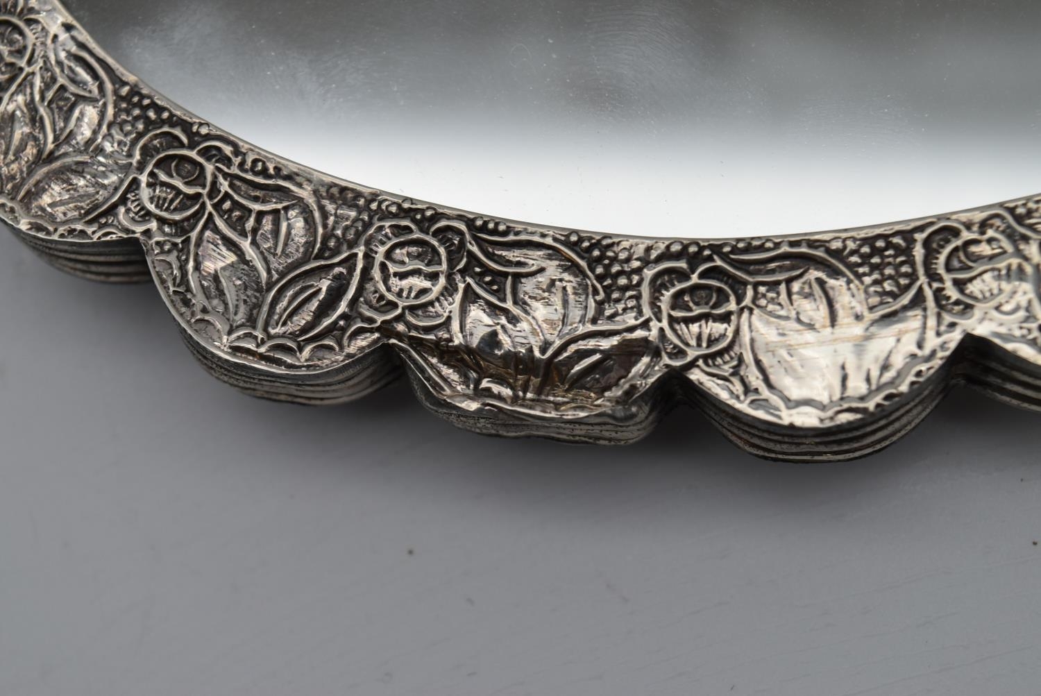 A 20th century Indian silver repousse mirror with stylised foliate and floral design and hanging - Image 6 of 8