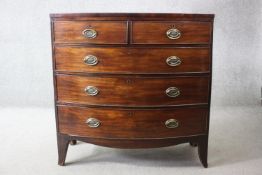 A Georgian mahogany bow fronted chest of drawers on swept bracket feet. H.105 W.104 D.50 cm.