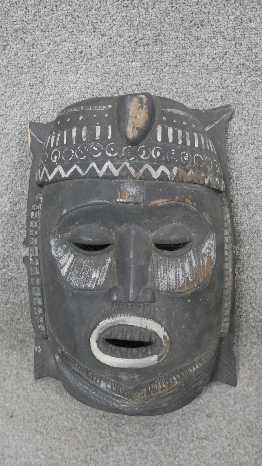 Three carved hardwood African tribal masks. H.44 W.25cm (largest) - Image 4 of 7