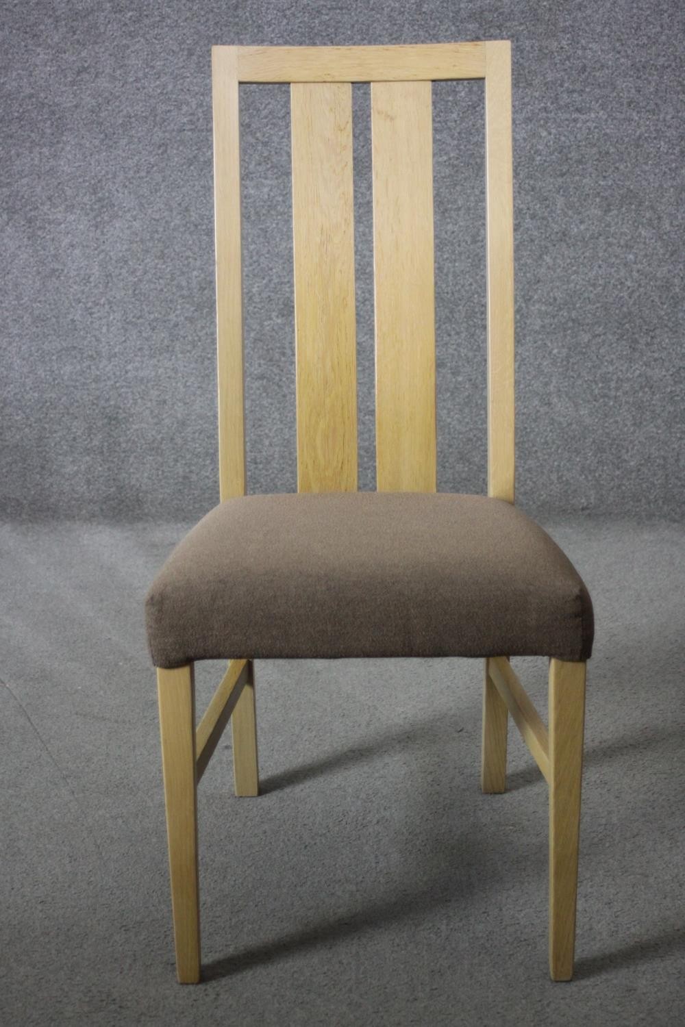 A set of six contemporary slat back light oak dining chairs with upholstered seats on square - Image 2 of 6