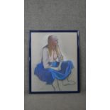 Belinda Wilson (1954-) A framed and glazed pastel on paper of a seated woman in blue skirt. Signed