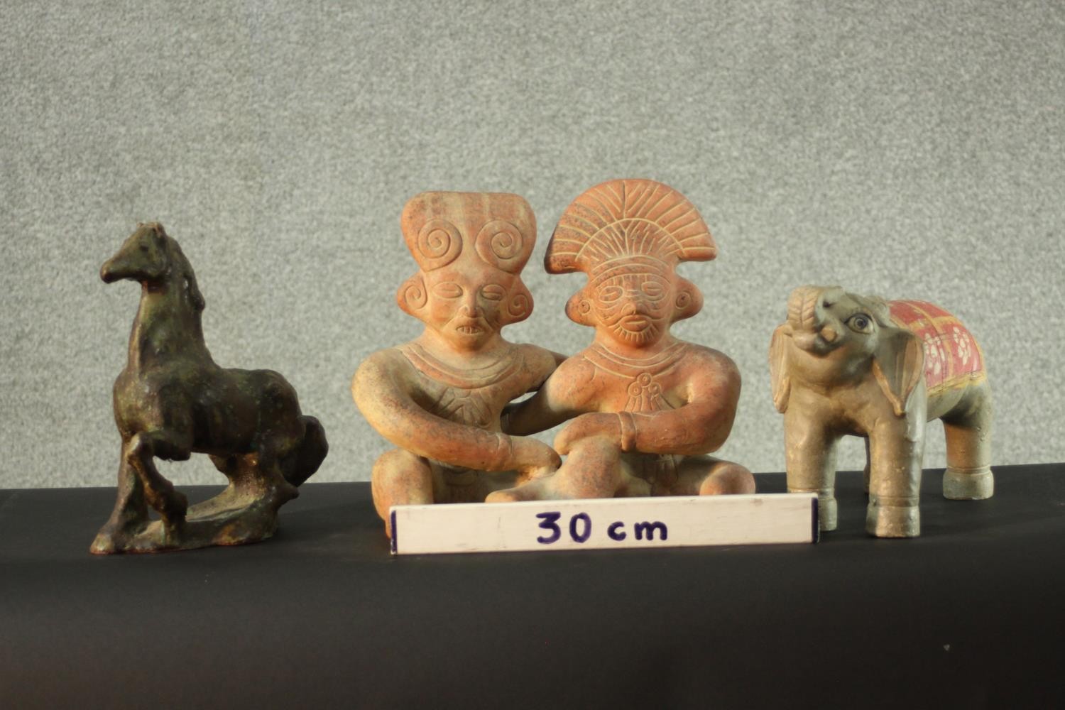 A terracotta figure of a couple, along with a ceramic elephant and a ceramic horse. H.30 W.30 D.6 - Image 2 of 11