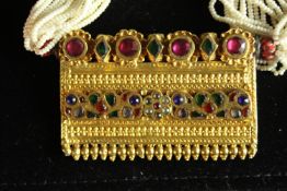 An early 20th century Indian yellow metal Timaniya, (Indian necklace, tests as 22 carat gold). Set