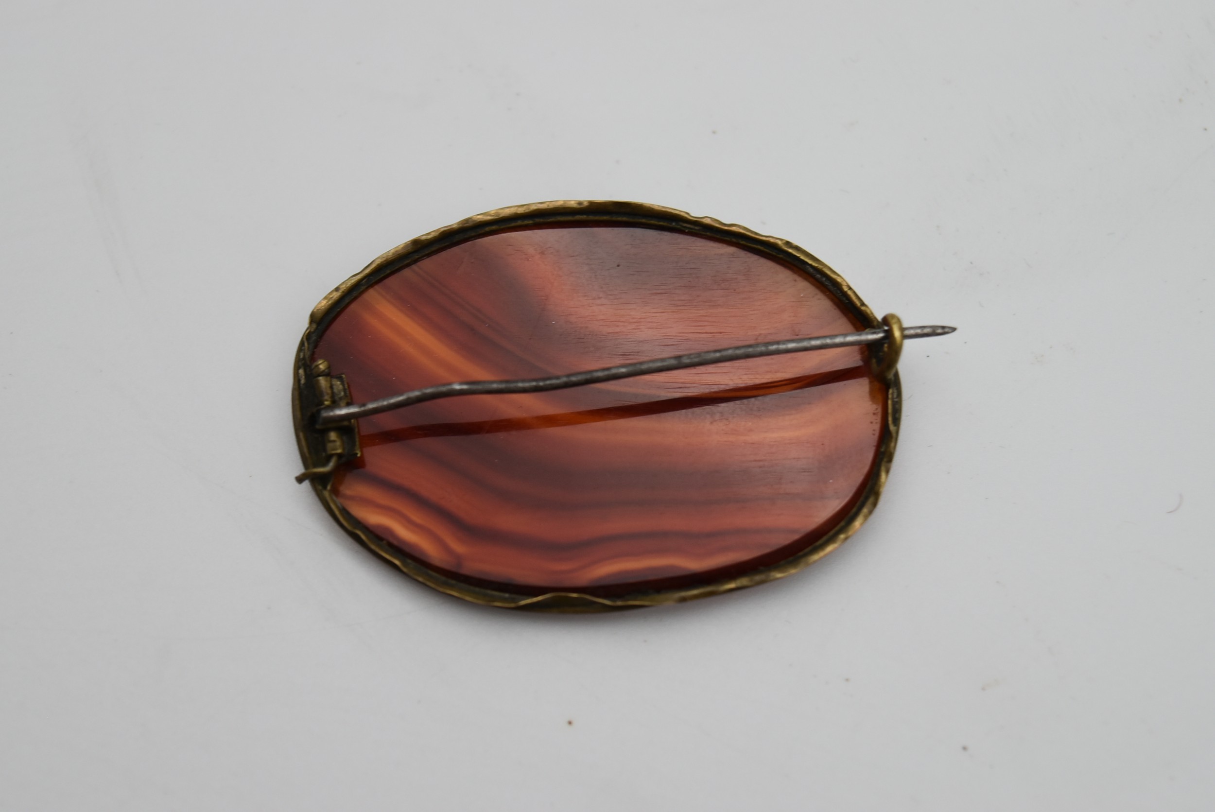 An antique Carnelian oval brooch with a secure pin to the reverse. L.7cm - Image 3 of 4