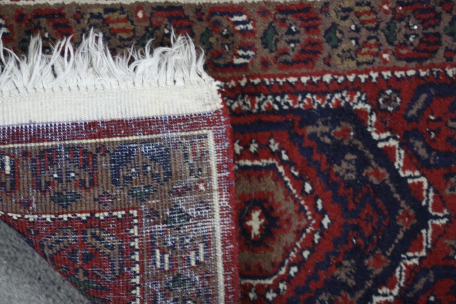 Two small Eastern rugs each on a red ground. L.110 W.60cm. (largest) - Image 8 of 8