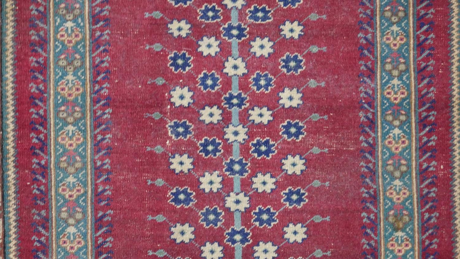 A Turkish Kayseri prayer mat with burgundy ground and floral multiple borders. L.170 W.115cm - Image 6 of 7