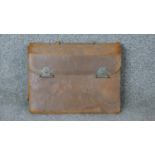 A leather cased travelling vintage men's grooming kit. Some pieces with ebony handles, includes,