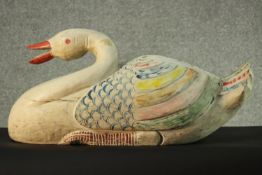 A large carved and painted swan. H.27 W.60 D.27 cm.