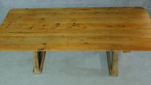 A pine refectory style dining table on X frame supports. H.79 W.196 D.78cm