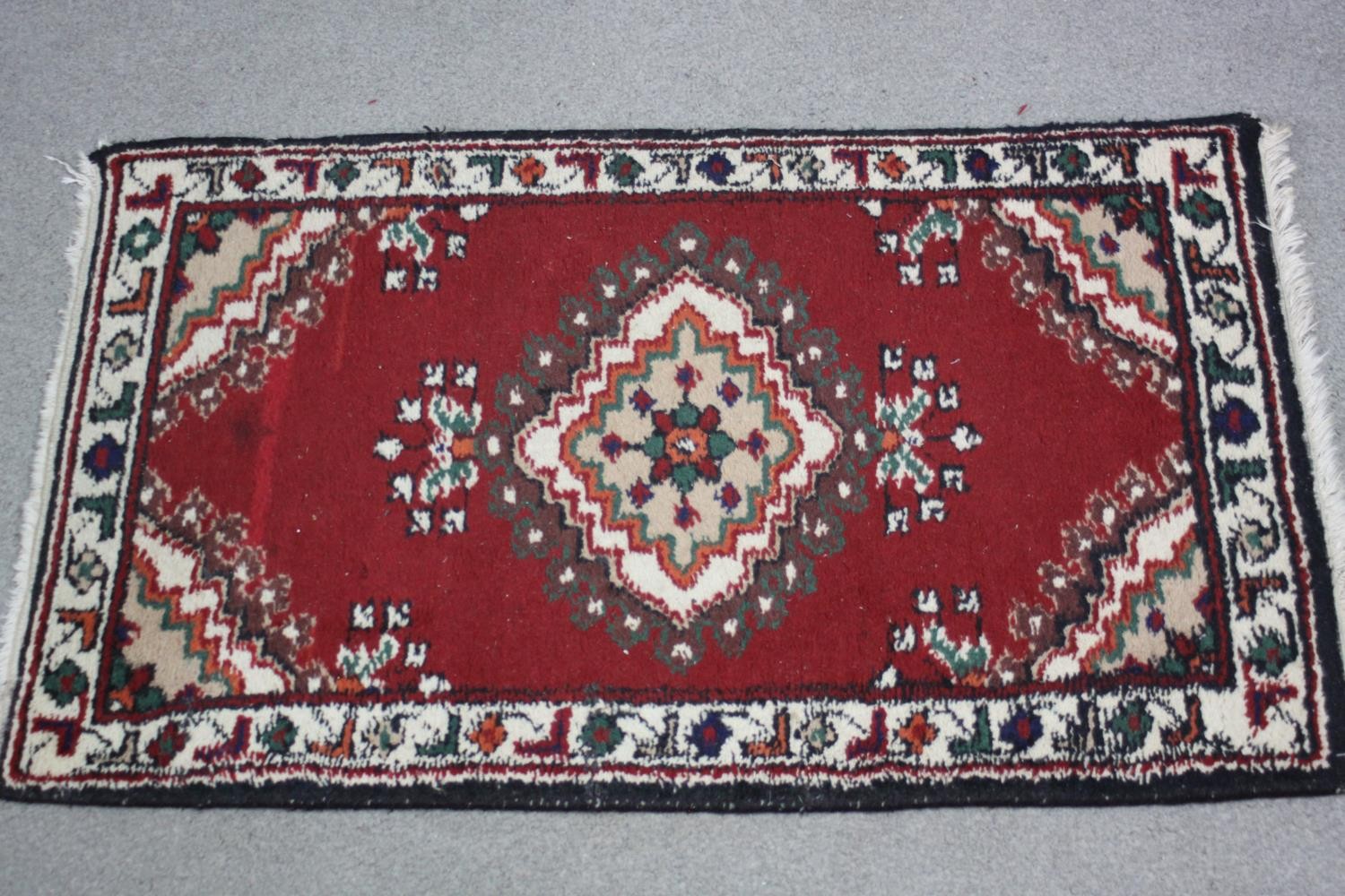 Two small Eastern rugs each on a red ground. L.110 W.60cm. (largest) - Image 4 of 8