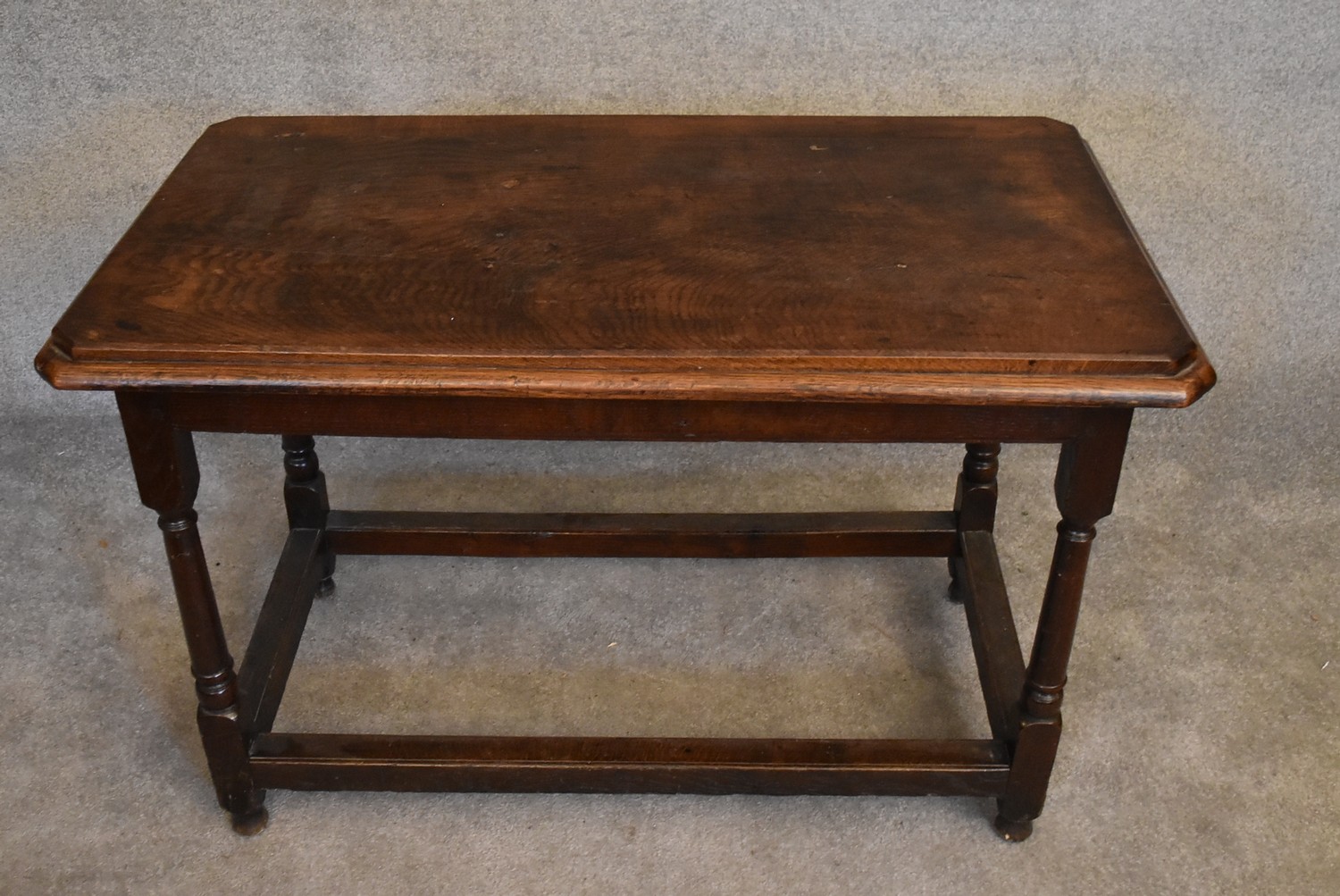 An antique oak hall or centre table on turned stretchered supports. H.76 x 112 x 63cm - Image 2 of 4