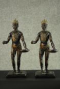 Two early 20th century spelter statues of African kings in tribal clothing, holding a tray with