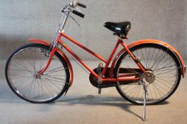 A vintage red Japanese post service bicycle. Makers label. Wheel dia. 60cm.