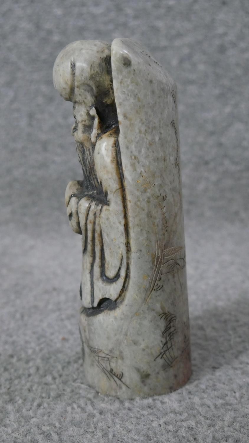 A carved Chinese soapstone chop in the form of an immortal along with two Indian brass deities on - Image 5 of 10