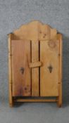 A rustic pine wall hanging cabinet. H.65 W.37 D.14cm