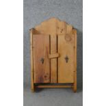 A rustic pine wall hanging cabinet. H.65 W.37 D.14cm