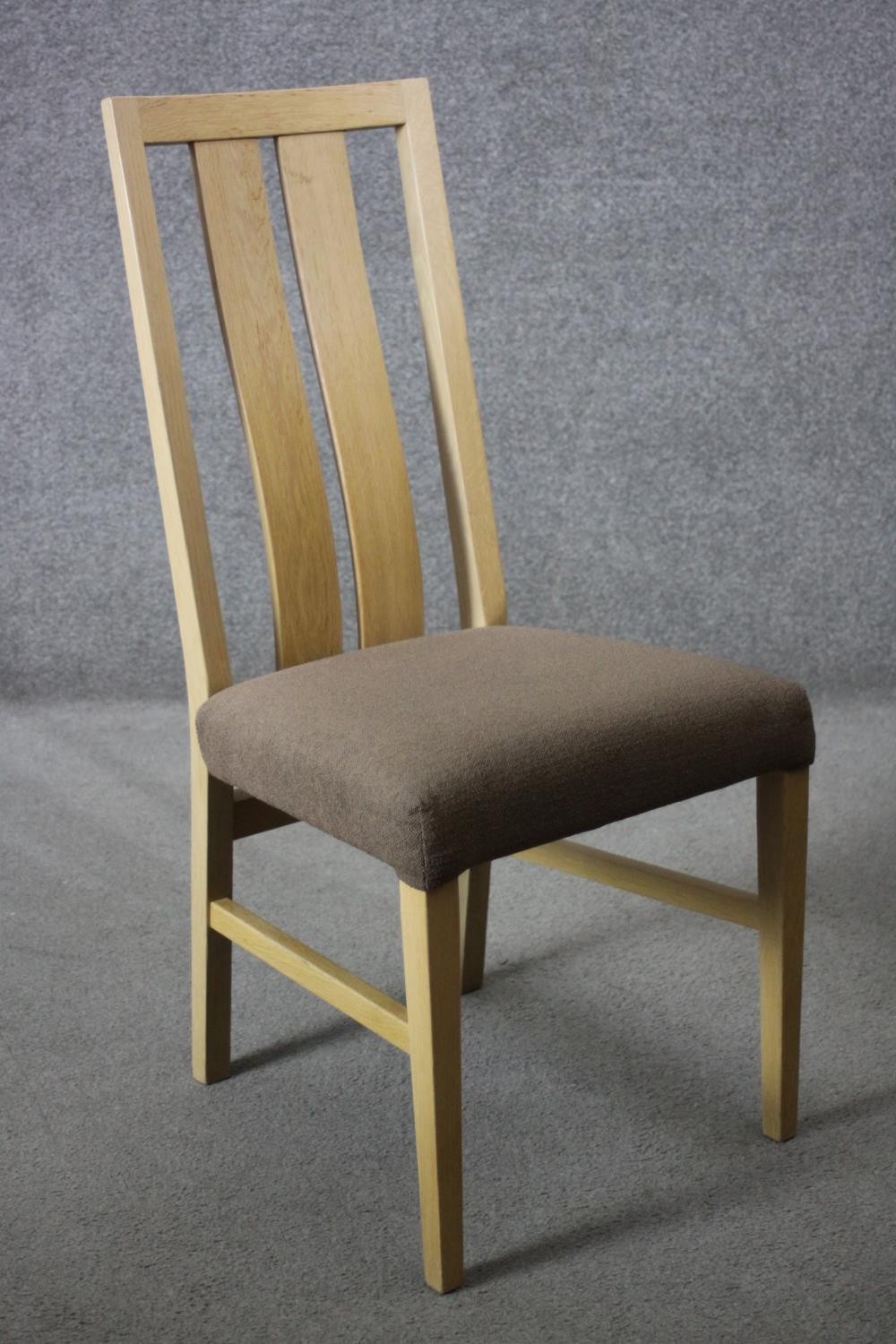A set of six contemporary slat back light oak dining chairs with upholstered seats on square - Image 3 of 6