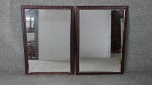 A pair of stained wood and gilded wall mirrors. H.84 W.59cm