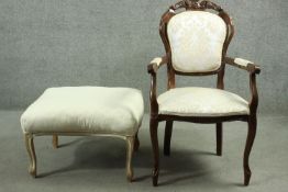 A French style walnut armchair along with a similar painted footstool.